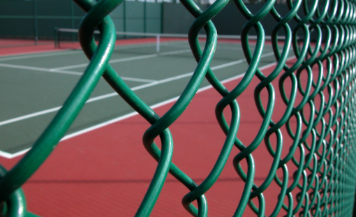 This is a photo of a new tennis court fence installed in Surrey , All works carried out by Tennis Court Construction Surrey