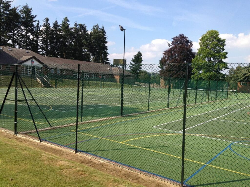 This is a photo of a new tennis court fence installed in Surrey , All works carried out by Tennis Court Construction Surrey