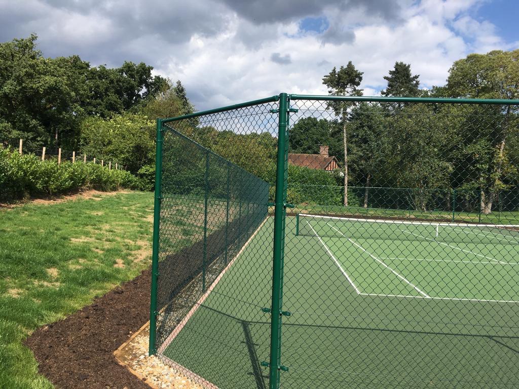 This is a photo of a new tennis court fence installed in Surrey , All works carried out by Tennis Court Construction Surrey