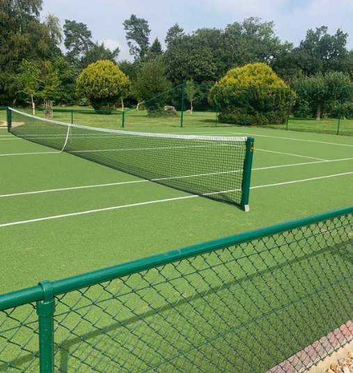 This is a photo of a new tennis court installed in Wiltshire, All works carried out by Tennis Court Construction Surrey