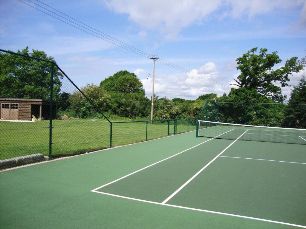 This is a photo of a new tennis court installed in Wiltshire, All works carried out by Tennis Court Construction Surrey