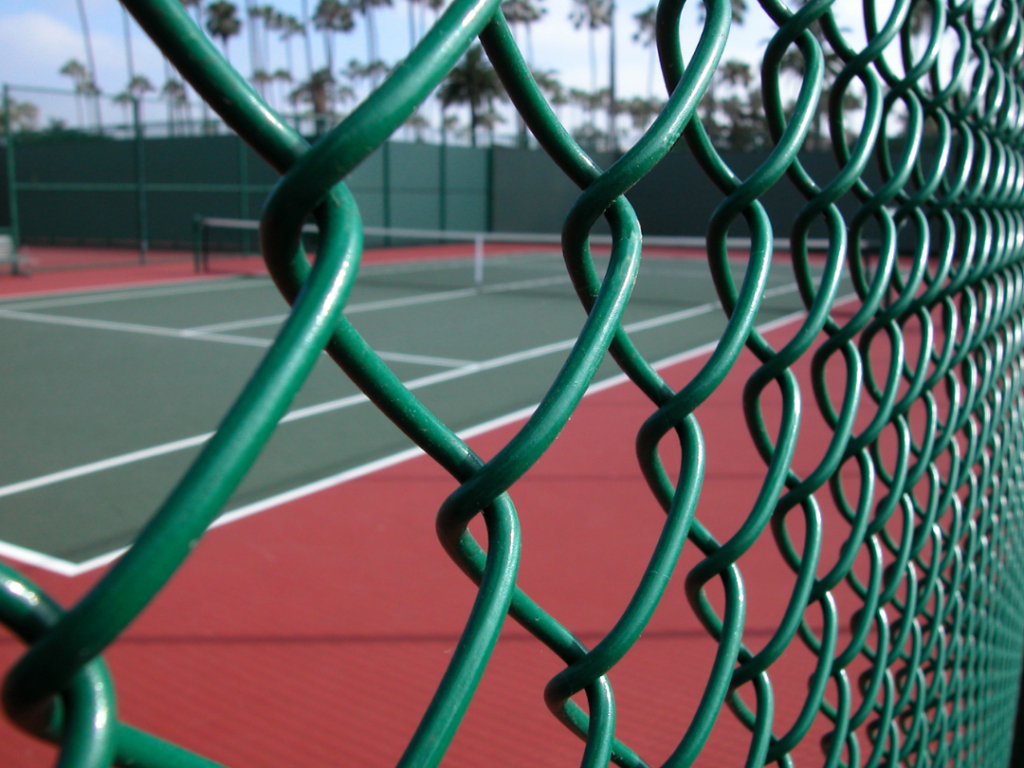This is a photo of a new tennis court fence installed in Surrey , All works carried out by Tennis Court Construction Surrey