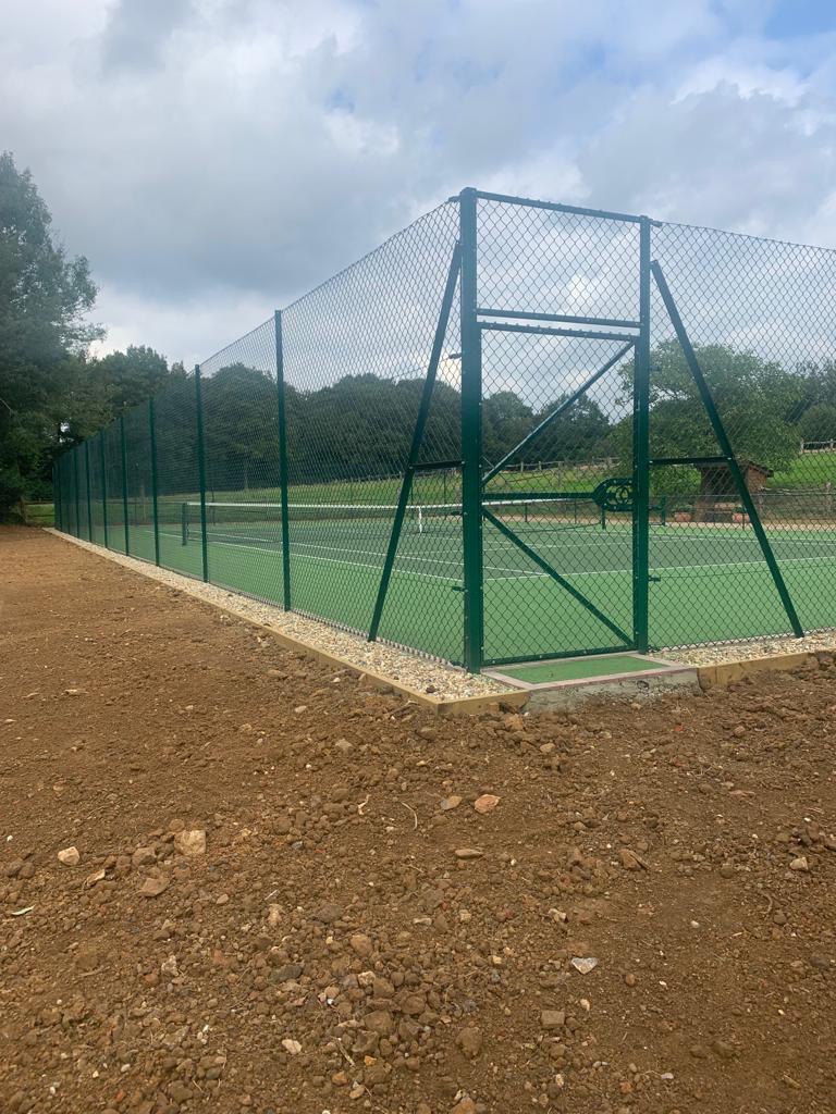 This is a photo of a new tennis court fence installed in Surrey , All works carried out by Tennis Court Construction Surrey